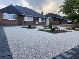 A nice new driveway, retaining wall and resin bound gravel garden feature completed in stonnall
